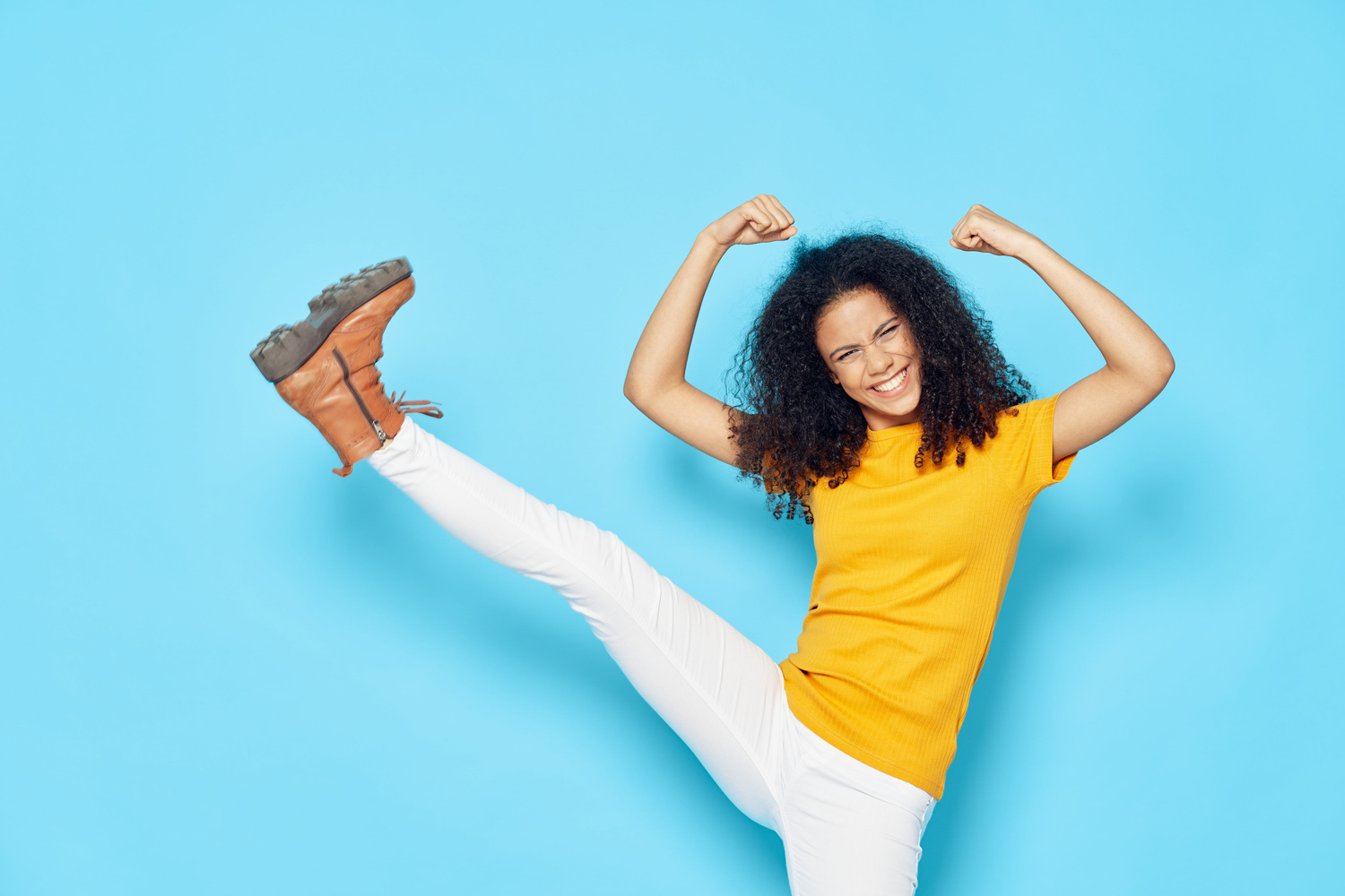 Happy Woman Showing Strength Gesture with Arms